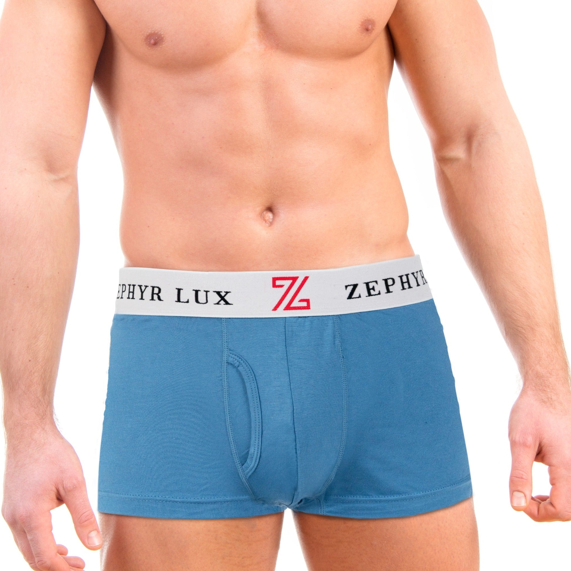Adult model wearing blue Zephyr Lux short-leg boxer briefs